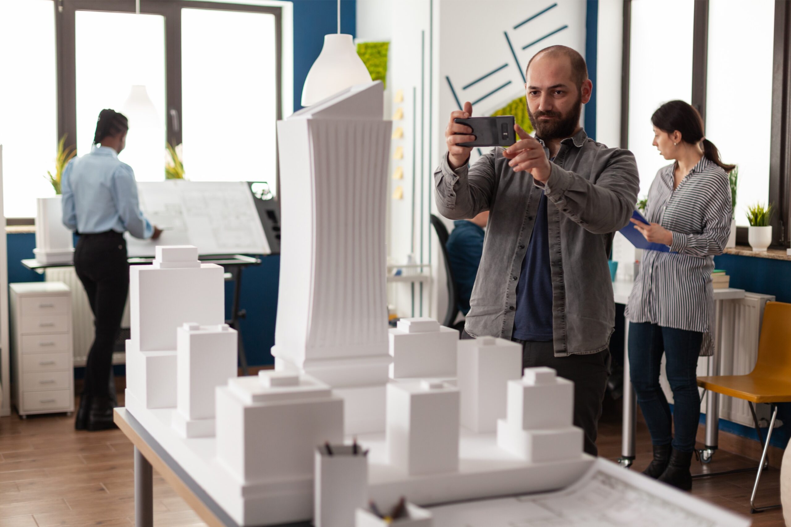 architect-profession-man-looking-maquette-layout